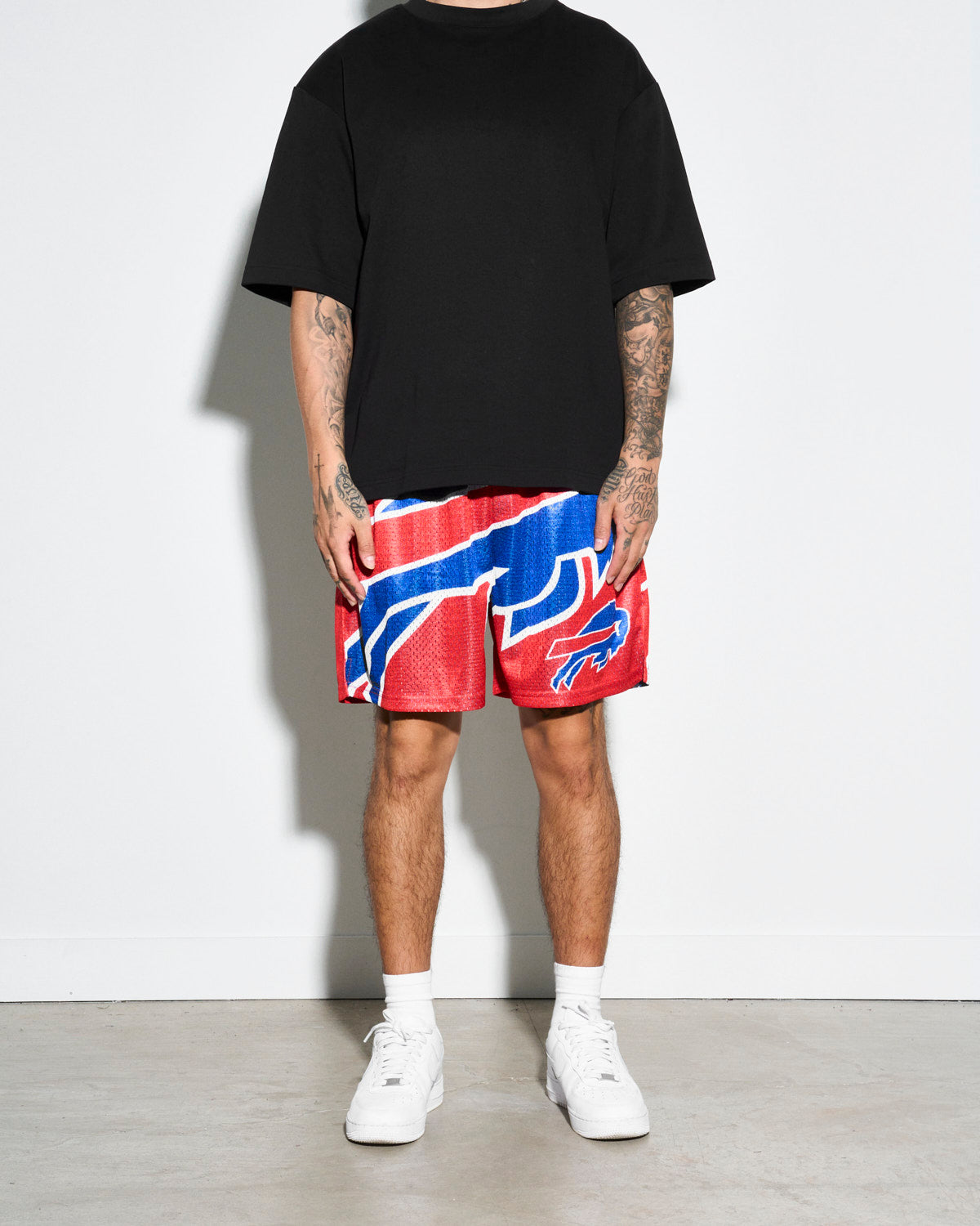 Men's mesh shorts with retro WWE, Music, and Movie themed prints